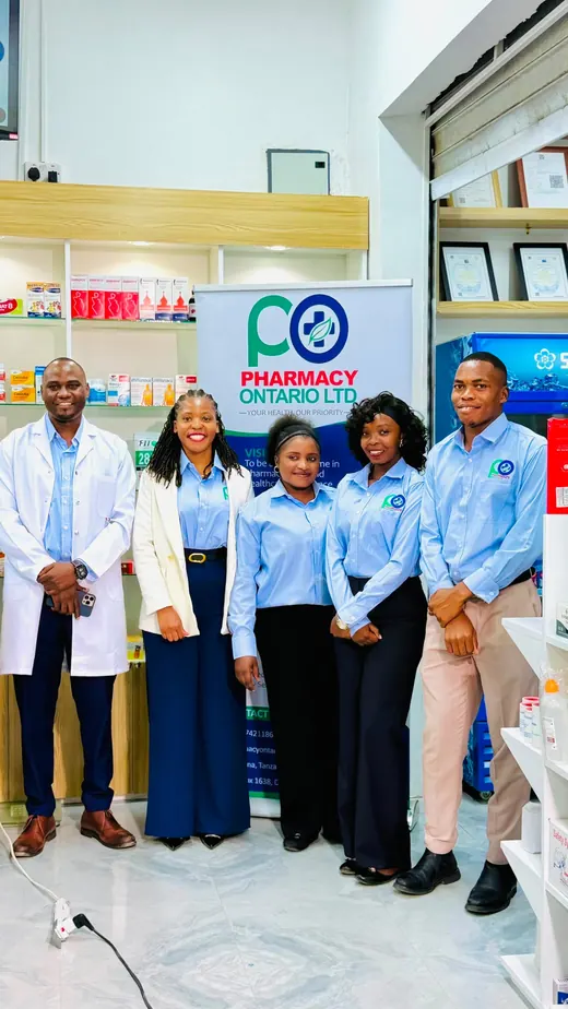 Five members of the Pharmacy Ontario team in front of the company banner
